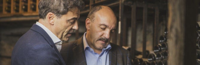 Lewis Chester (L) and Gérard Basset at work in the wine cellar.